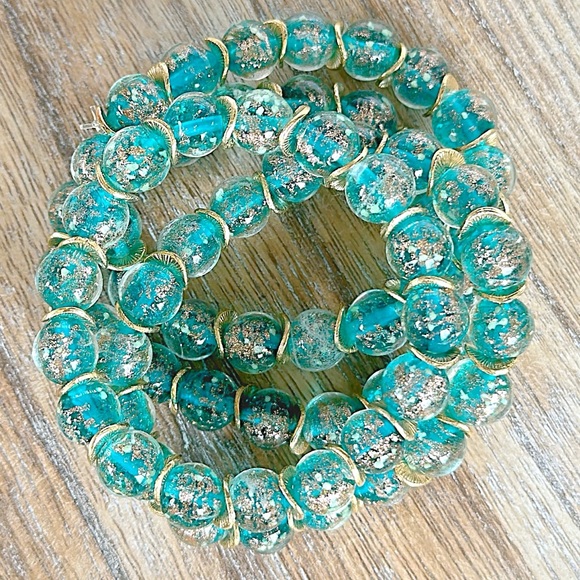Lake blue firefly 8mm glass beaded bracelet with gold filled wavy spacer beads - Picture 2 of 4